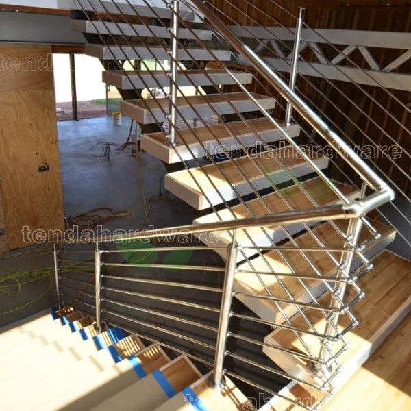 entre spine stairs wooden treads stair with rod bar railing 