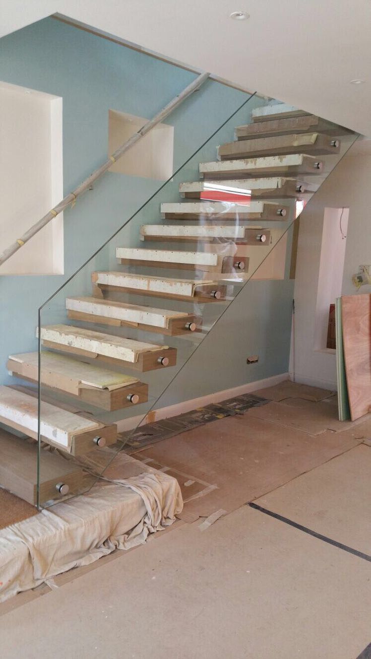 wood floating stair with frameless glass railing