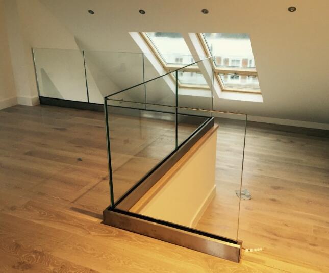 frameless glass rails with stainless steel clad carbon steel u channel 
