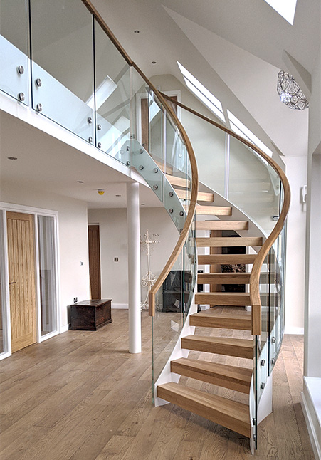 curved stair with wood tread glass railing