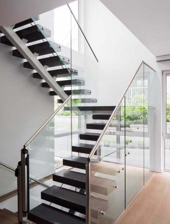 mono stringer stair with wood tread and glass railing