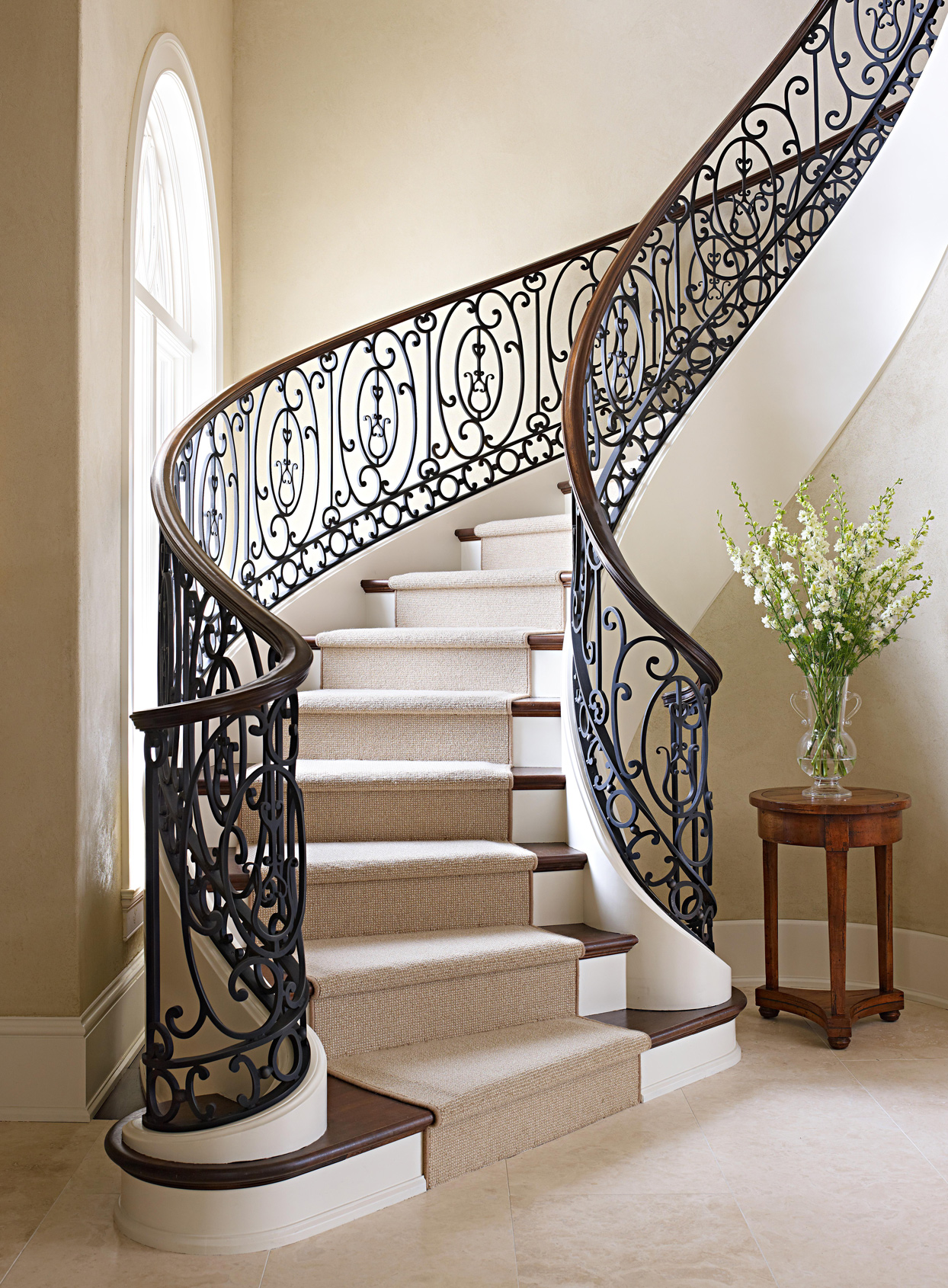 wrought iron railing with wood handrail