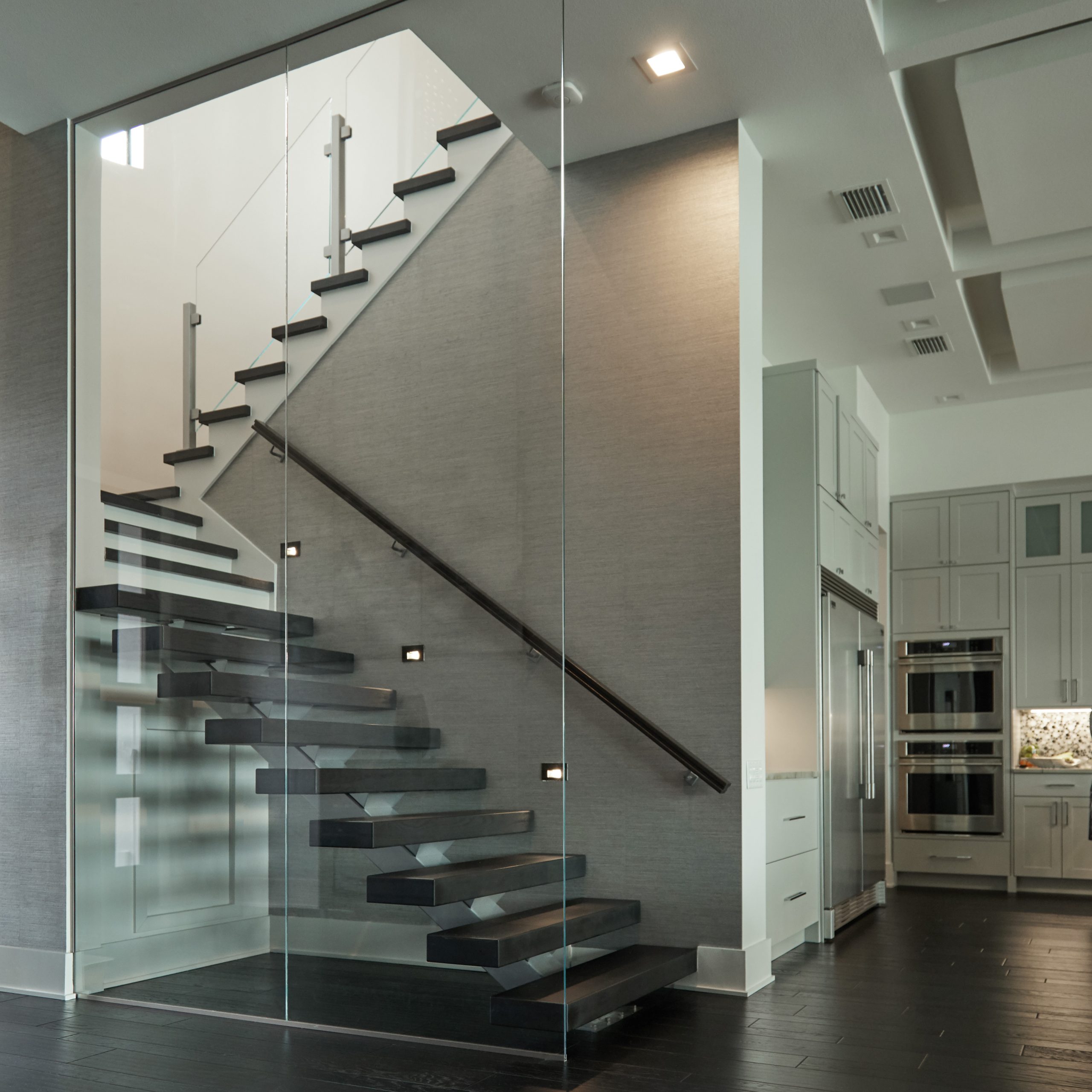 straight stair with mono beam and glass partition