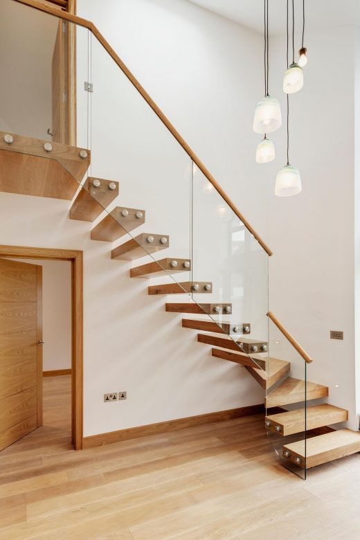 Winder Floating stair with wood tread and glass railing 