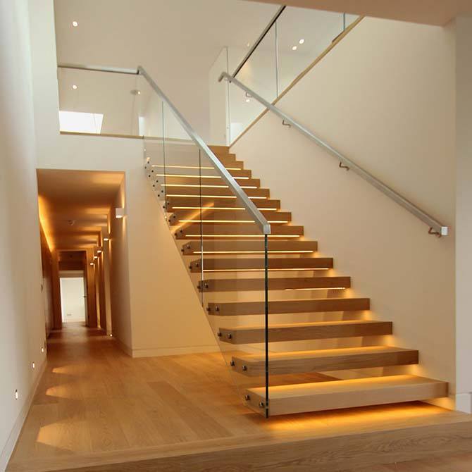 wood floating staircase with frameless glass railing